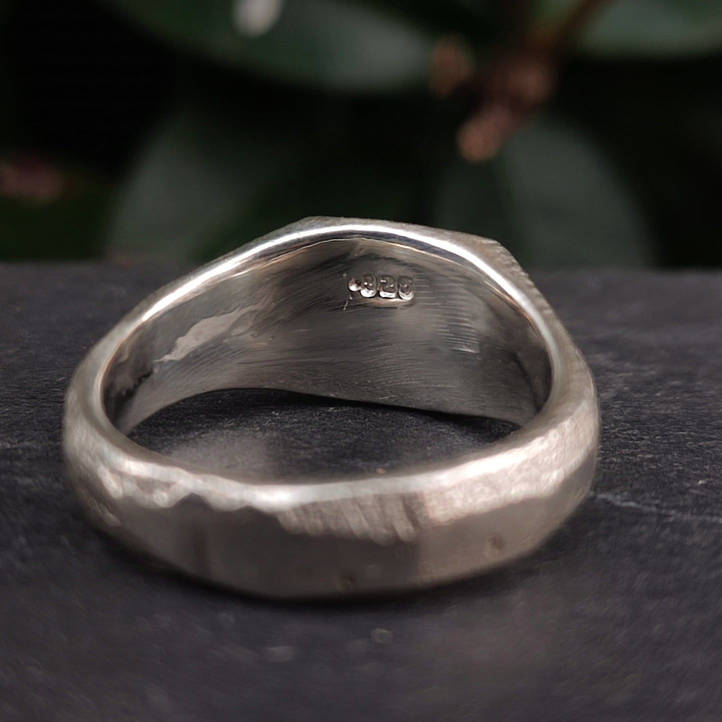 A close-up of the Raw Square Signet by silverhollowjewellery, crafted from recycled 925 sterling silver. The ring features a visible "925" stamp and a unique organic textured surface.