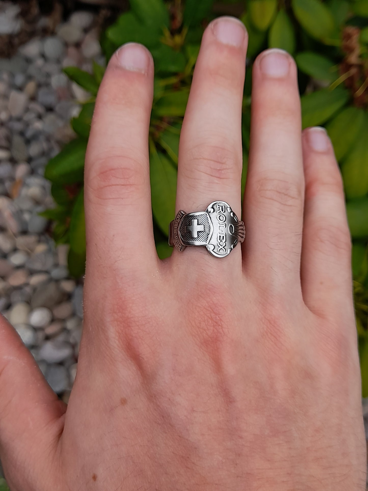 silver rolex spoon ring on hand