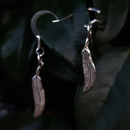 Silver feather jewellery pieces