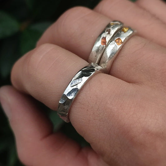 man wearing silver rings