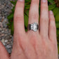 silver rolex spoon ring on hand
